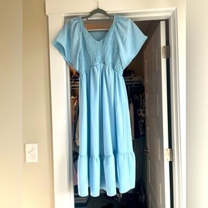 Ankle length baby blue dress.